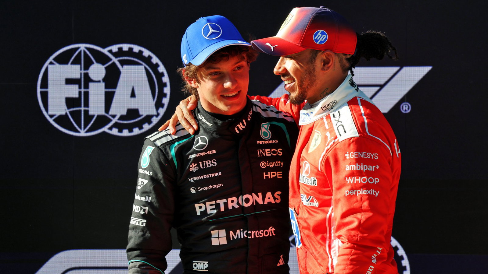 Antonelli is congratulated by Hamilton in parc ferme 