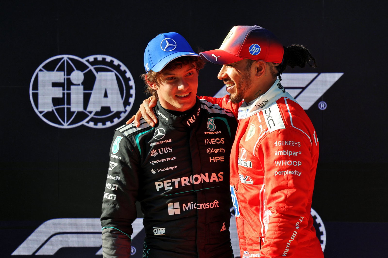 Antonelli is congratulated by Hamilton in parc ferme 