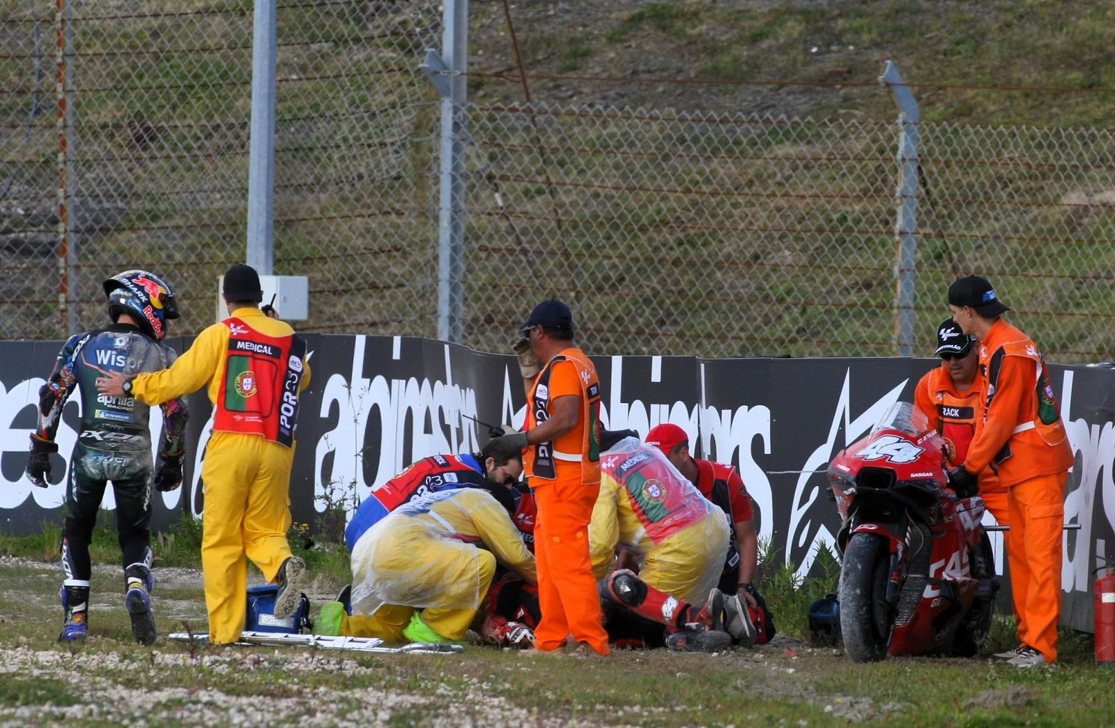 Miguel Oliveira looks on as Pol Espargaro receives medical treatment after his 2023 Portimao accident.