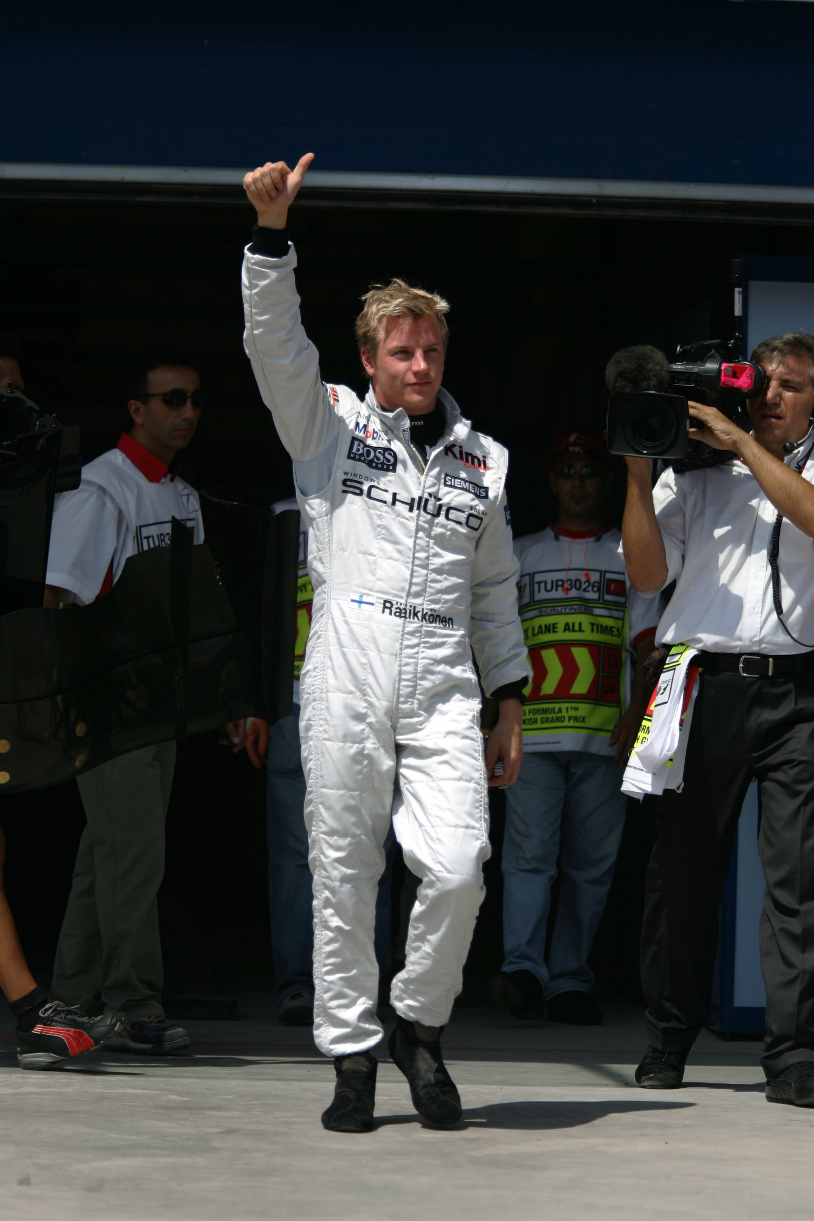 Kimi Raikkonen celebrates after taking pole position for the Turkish GP