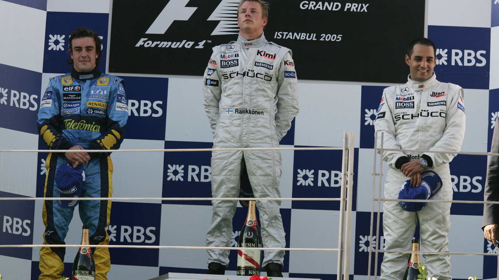 Turkish GP winner, Kimi Raikkonen on the podium with Fernando Alonso [2nd] and Juan Montoya [3rd]