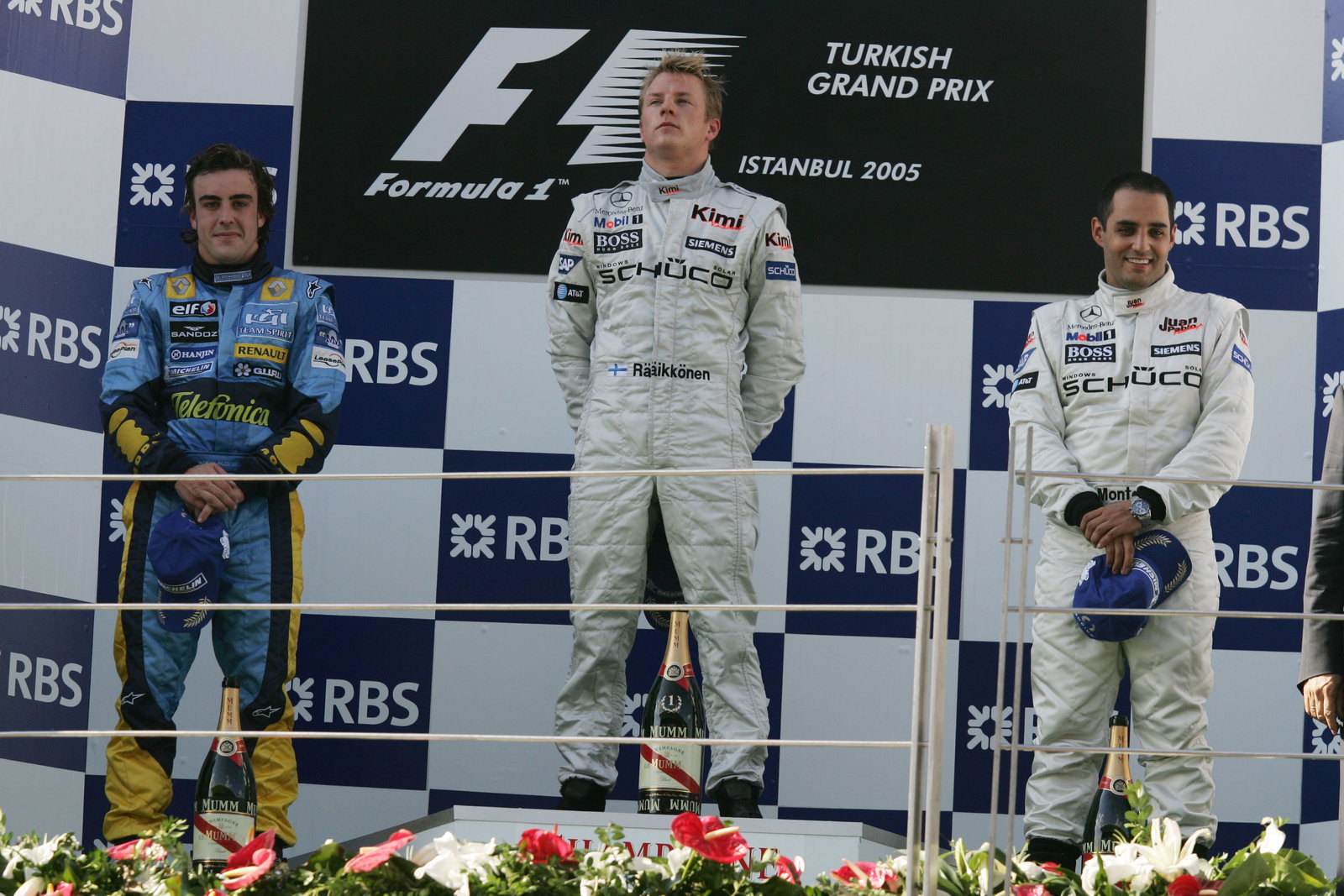 Turkish GP winner, Kimi Raikkonen on the podium with Fernando Alonso [2nd] and Juan Montoya [3rd]