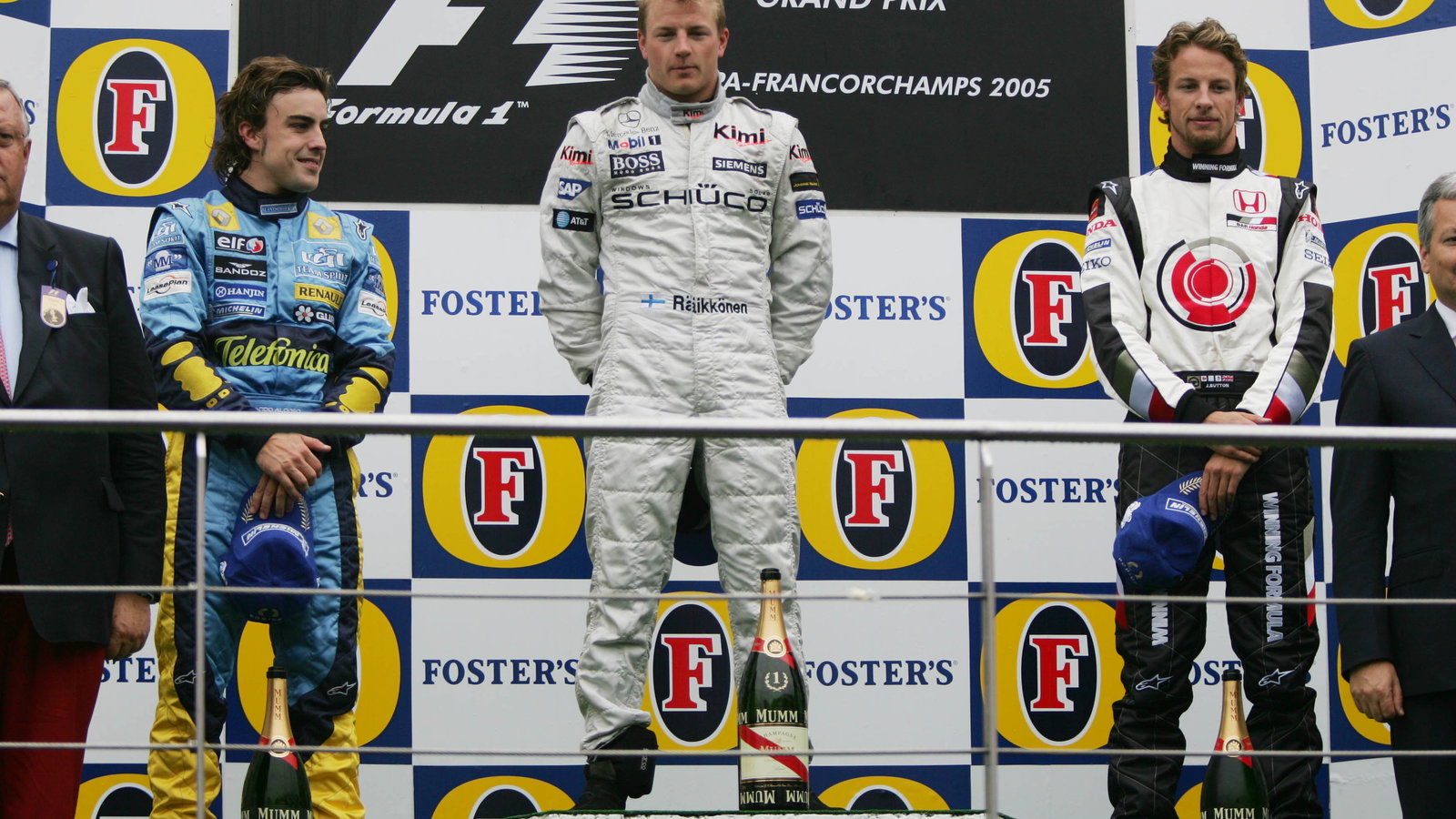 Belgian GP winner, Kimi Raikkonen on the podium with Fernando Alonso [2nd] and Jenson Button [3rd]