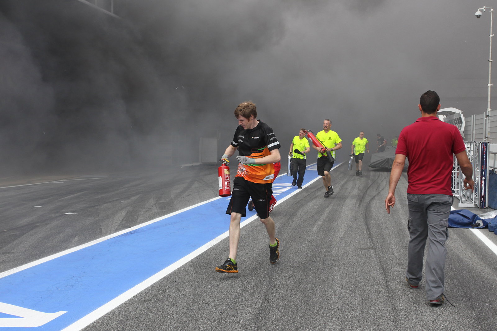 13.05.2012- A fire in the Williams pit garage after the celebrations is tended to by members of all