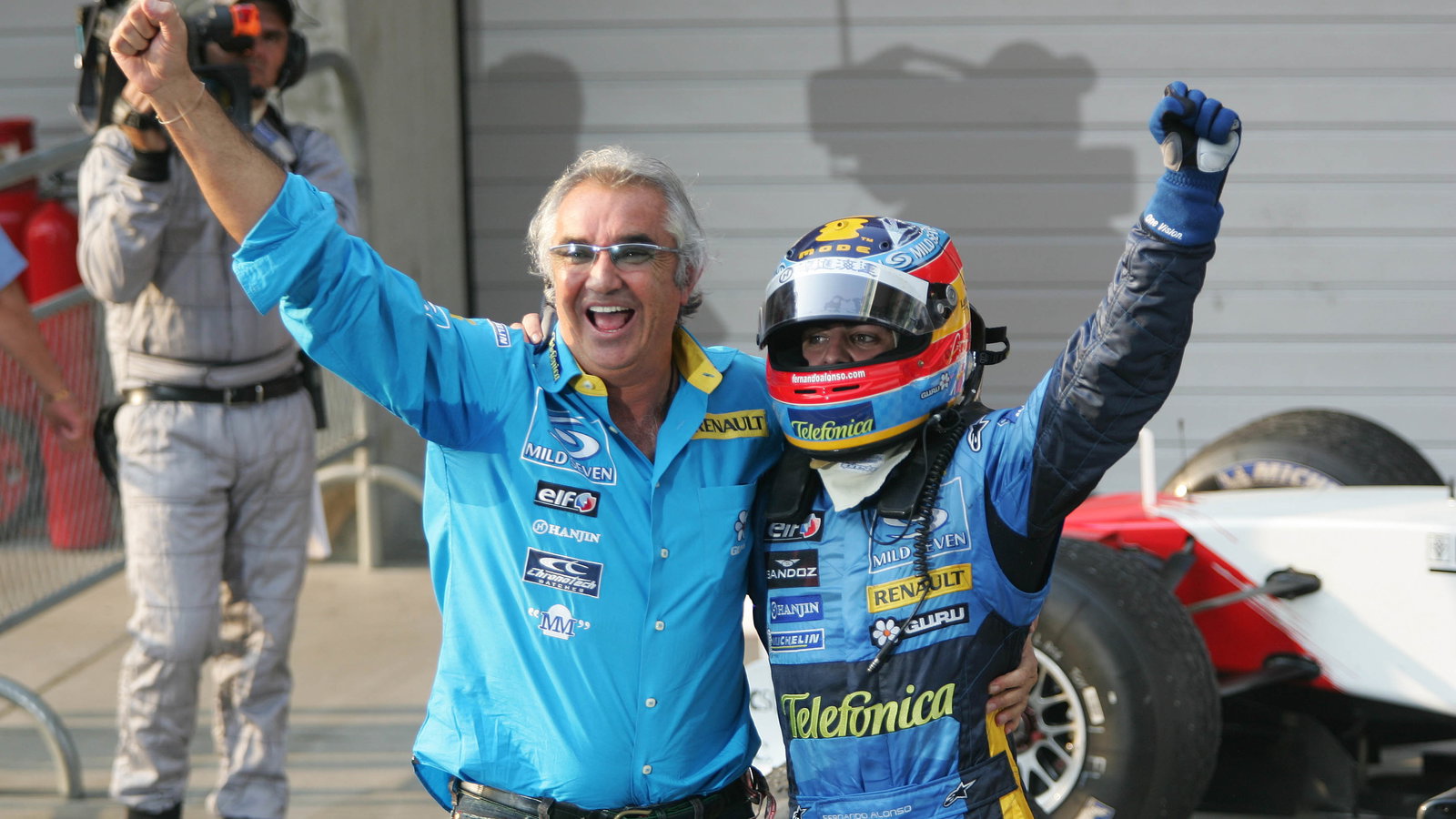 Chinese GP race winner Fernando Alonso and Flavio Briatore celebrate helping Renault to the construc