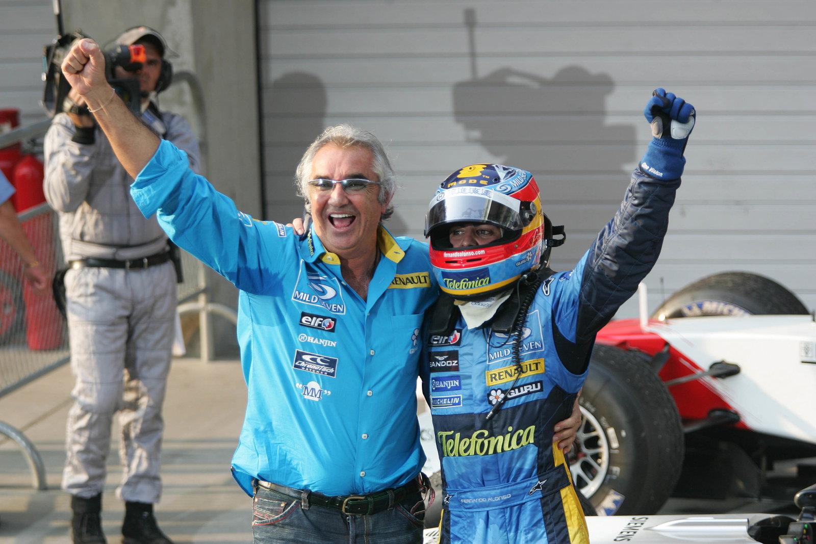 Chinese GP race winner Fernando Alonso and Flavio Briatore celebrate helping Renault to the construc