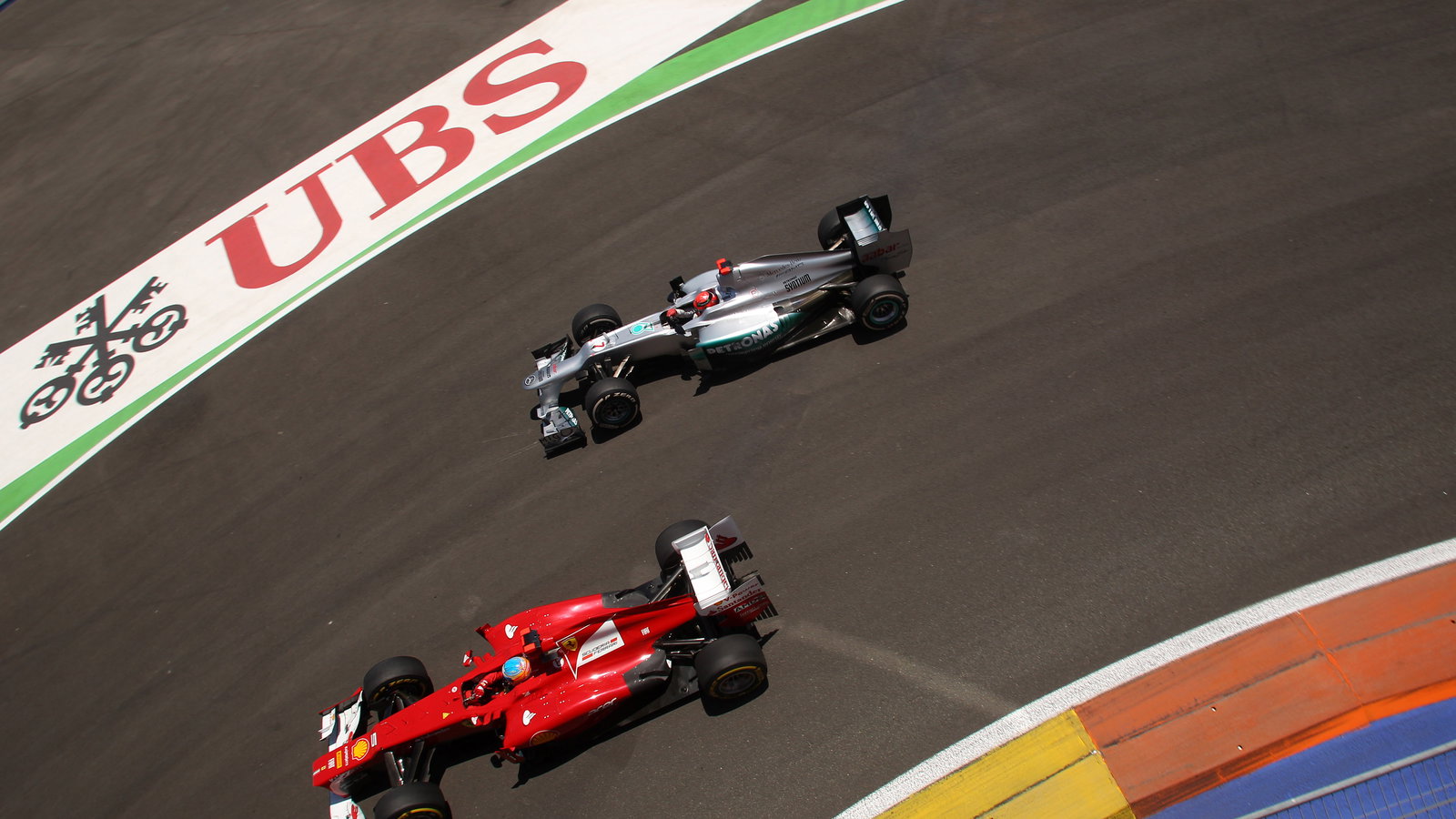 24.06.2012- Race, Fernando Alonso (ESP) Scuderia Ferrari F2012 and Michael Schumacher (GER) Mercedes
