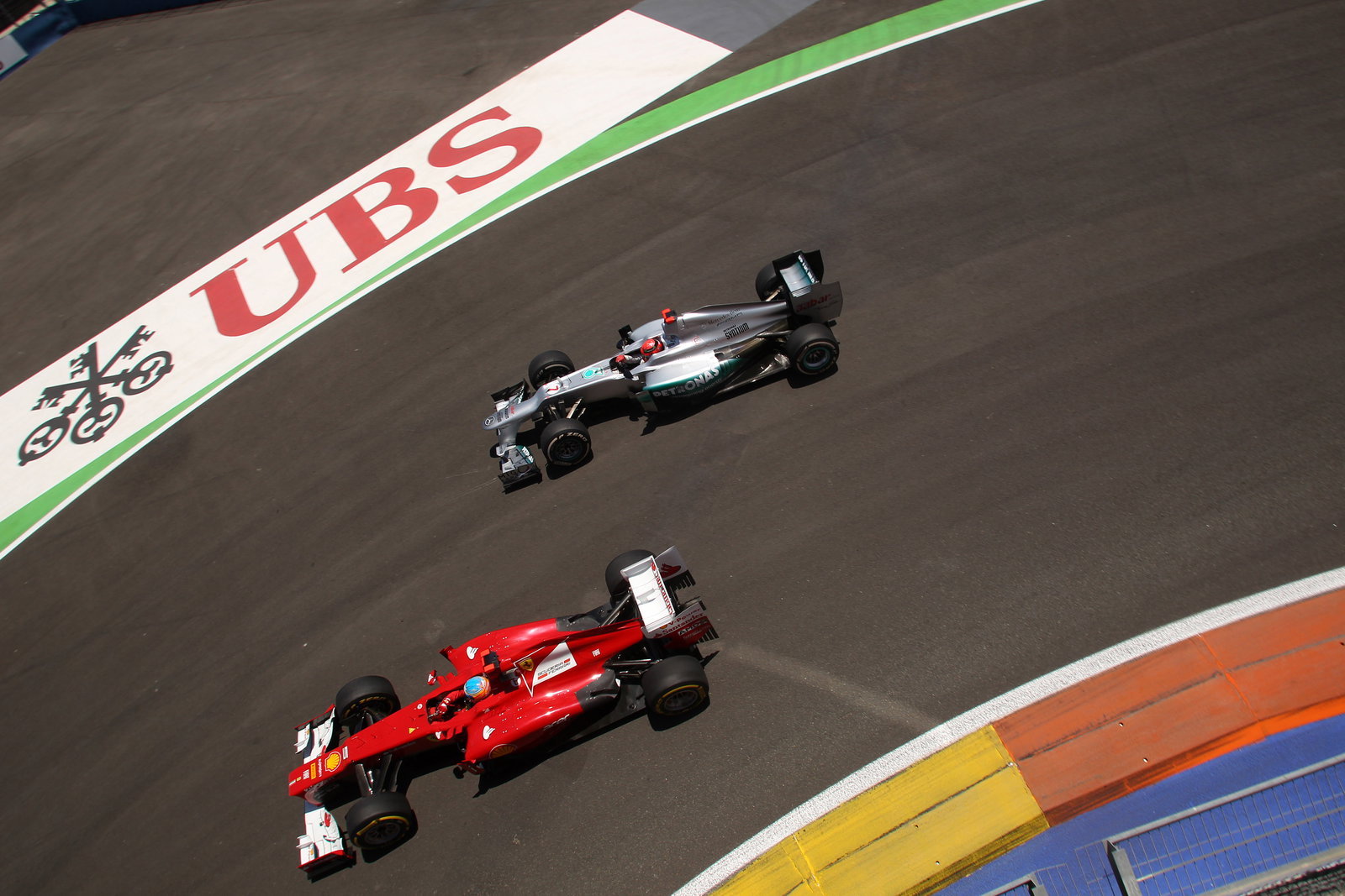 24.06.2012- Race, Fernando Alonso (ESP) Scuderia Ferrari F2012 and Michael Schumacher (GER) Mercedes