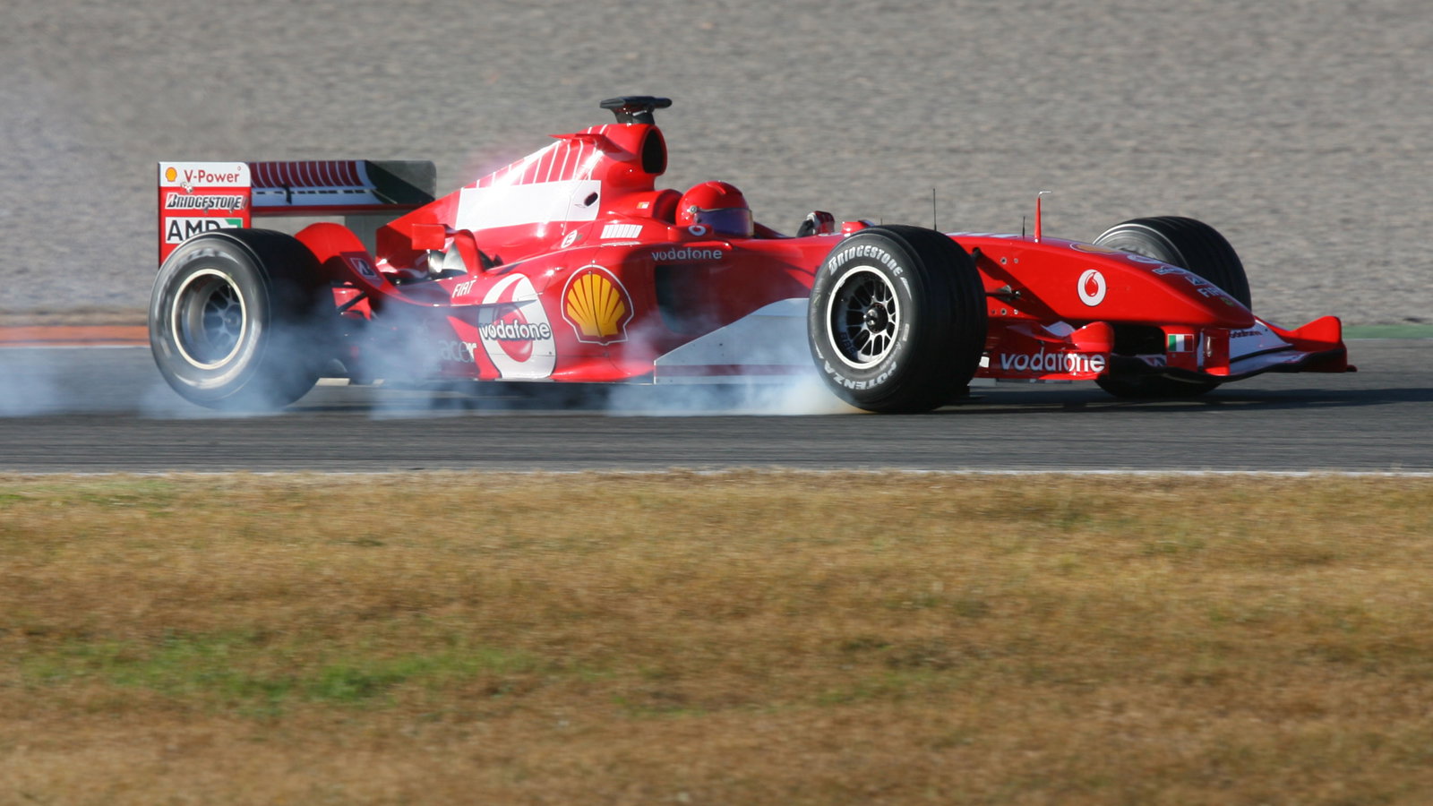 Valentino Rossi locks up the wheels in the Ferrari F2004