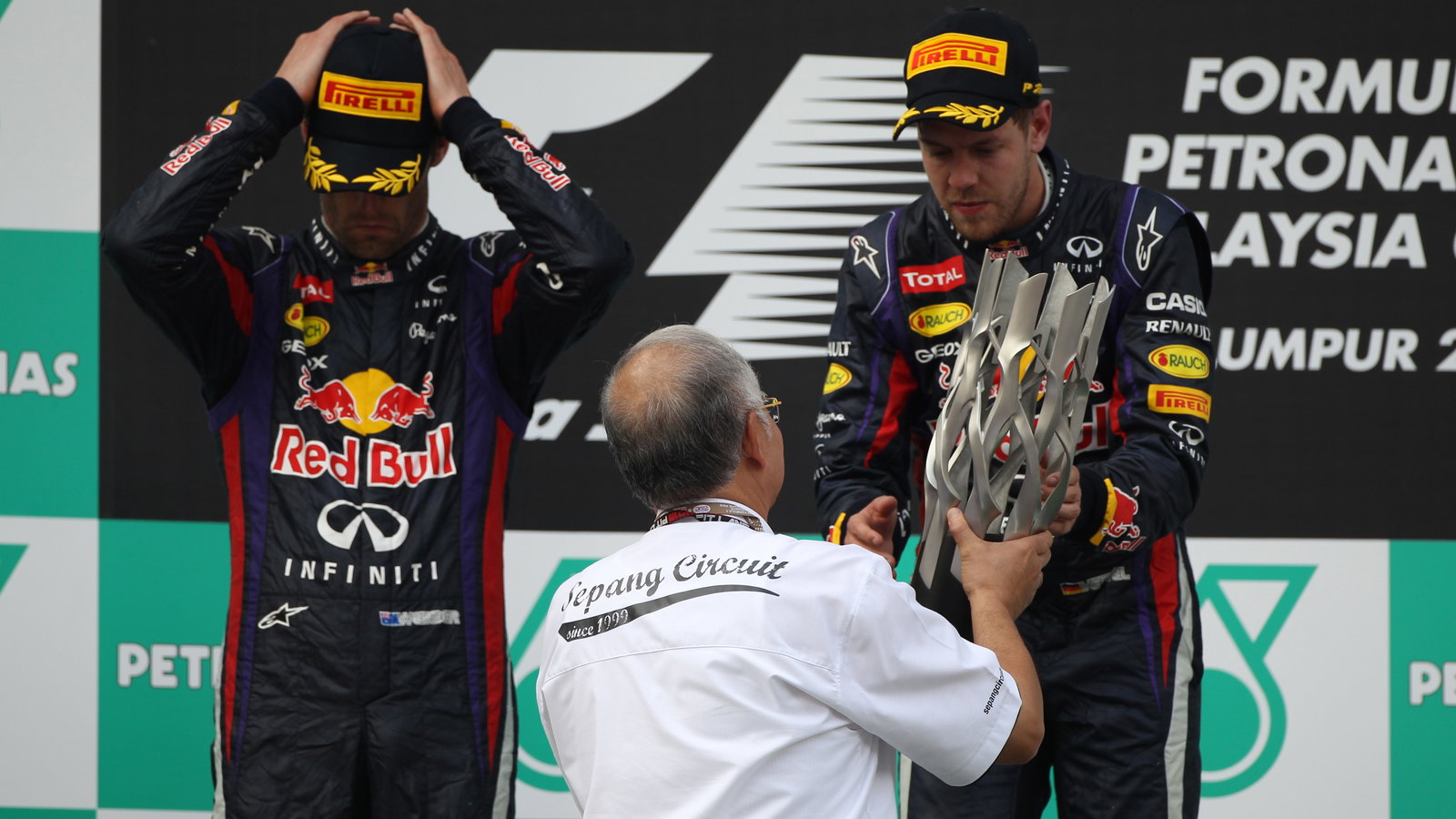 24.03.2013- Race, the podium; winner Sebastian Vettel (GER) Red Bull Racing RB9, 2nd Mark Webber (AU