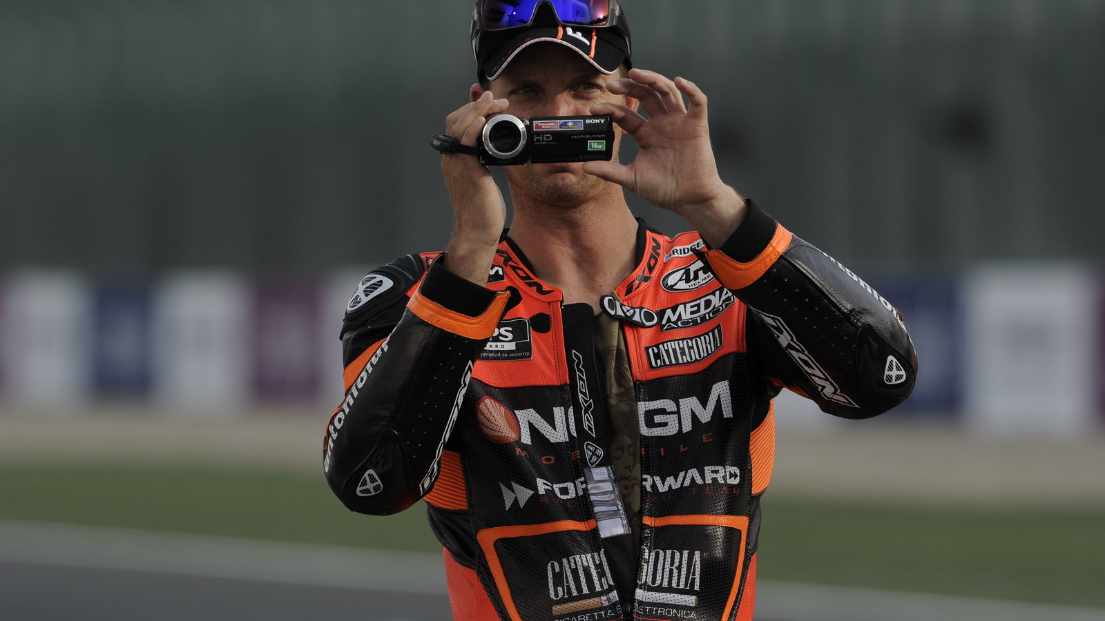 Edwards, filming on his camcorder, Qatar MotoGP 2013