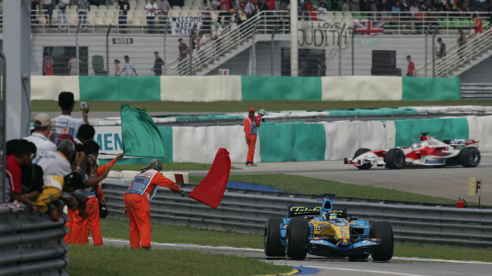 Race winner Giancarlo Fisichella celebrates his second win for Renault in the Malaysian Grand Prix