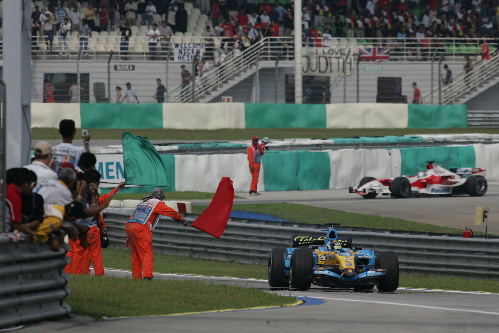 Race winner Giancarlo Fisichella celebrates his second win for Renault in the Malaysian Grand Prix