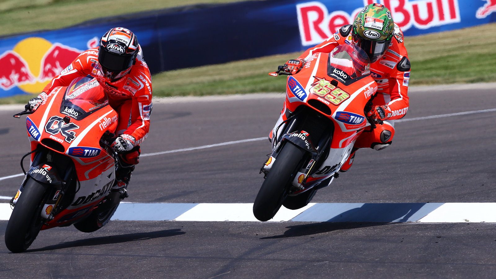 Dovizioso and Hayden fly through air, wheels off ground, Indianapolis MotoGP 2013