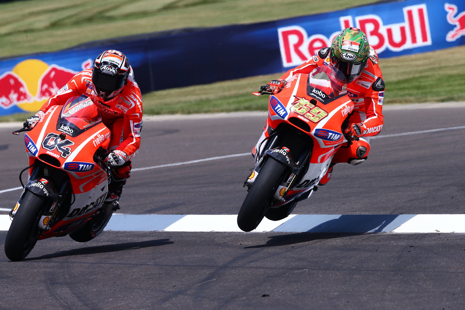 Dovizioso and Hayden fly through air, wheels off ground, Indianapolis MotoGP 2013