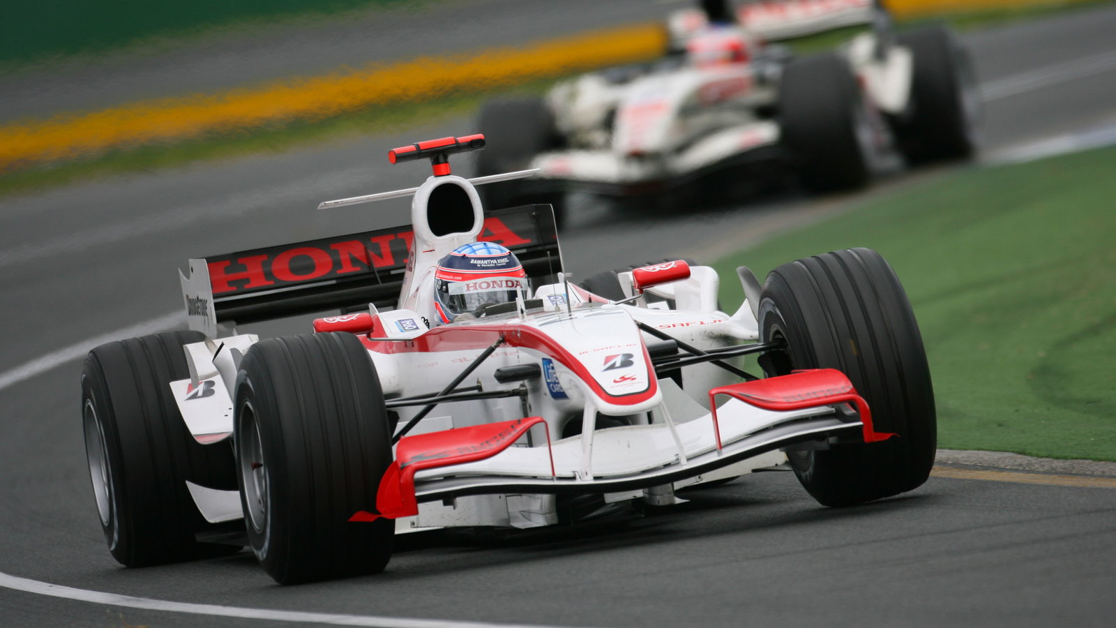 Takuma Sato leads Rubens Barrichello