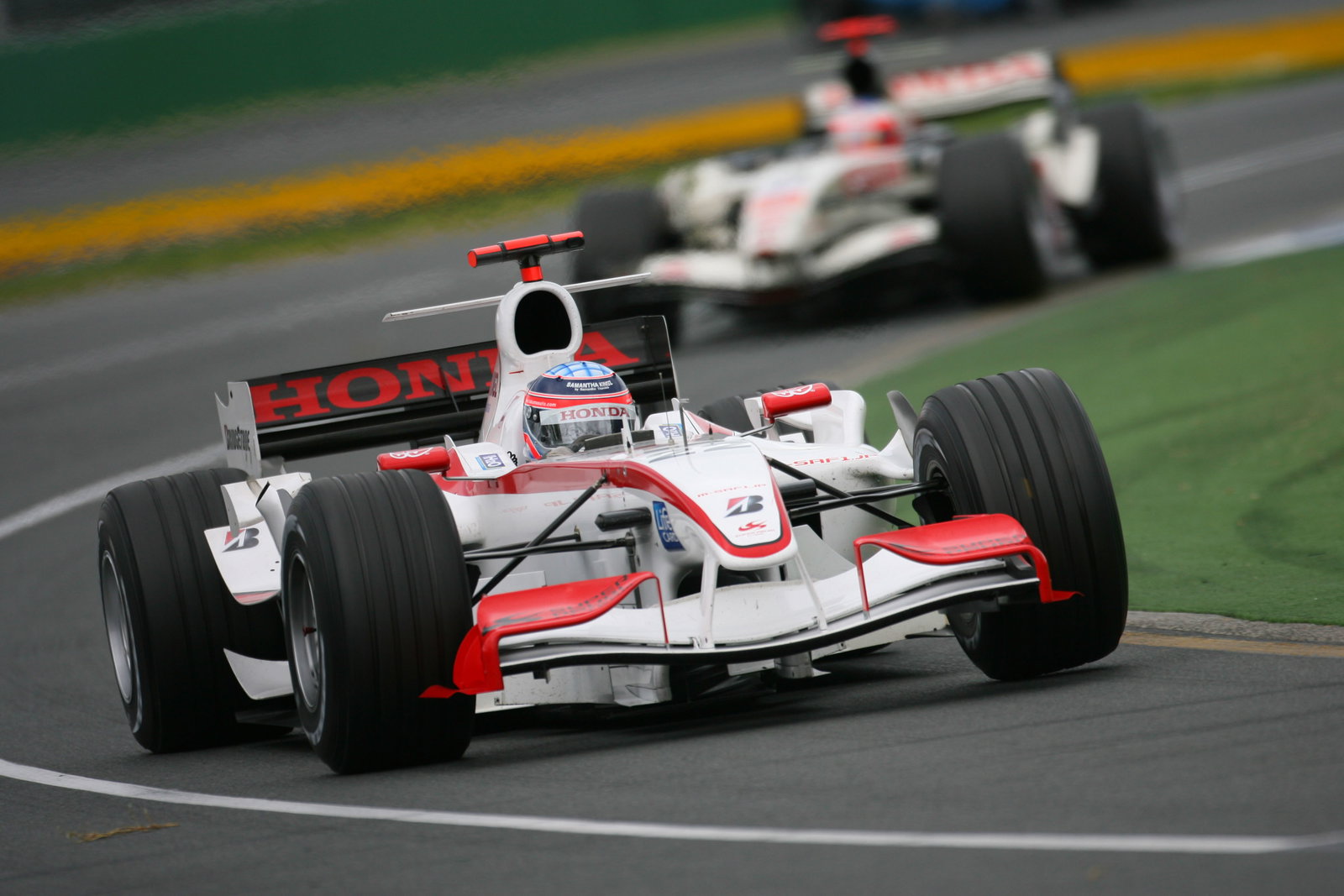 Takuma Sato leads Rubens Barrichello