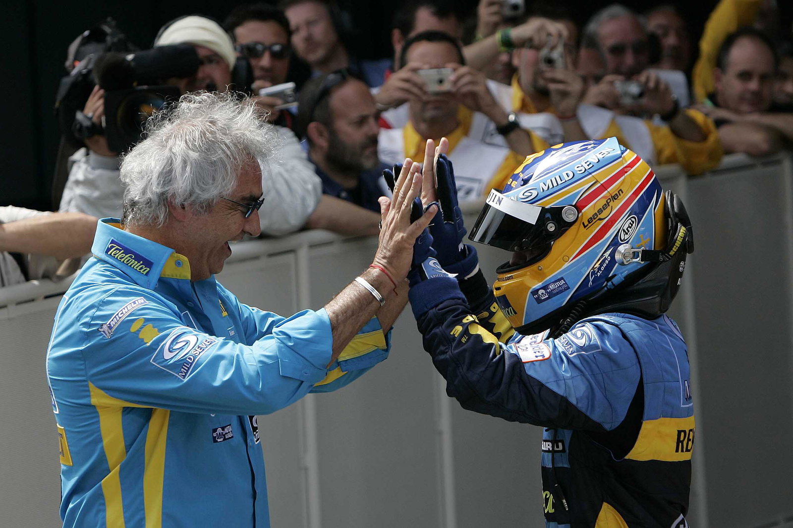 Renault`s Fernando Alonso celebrates his Spanish GP win with team boss, Flavio Briatore
