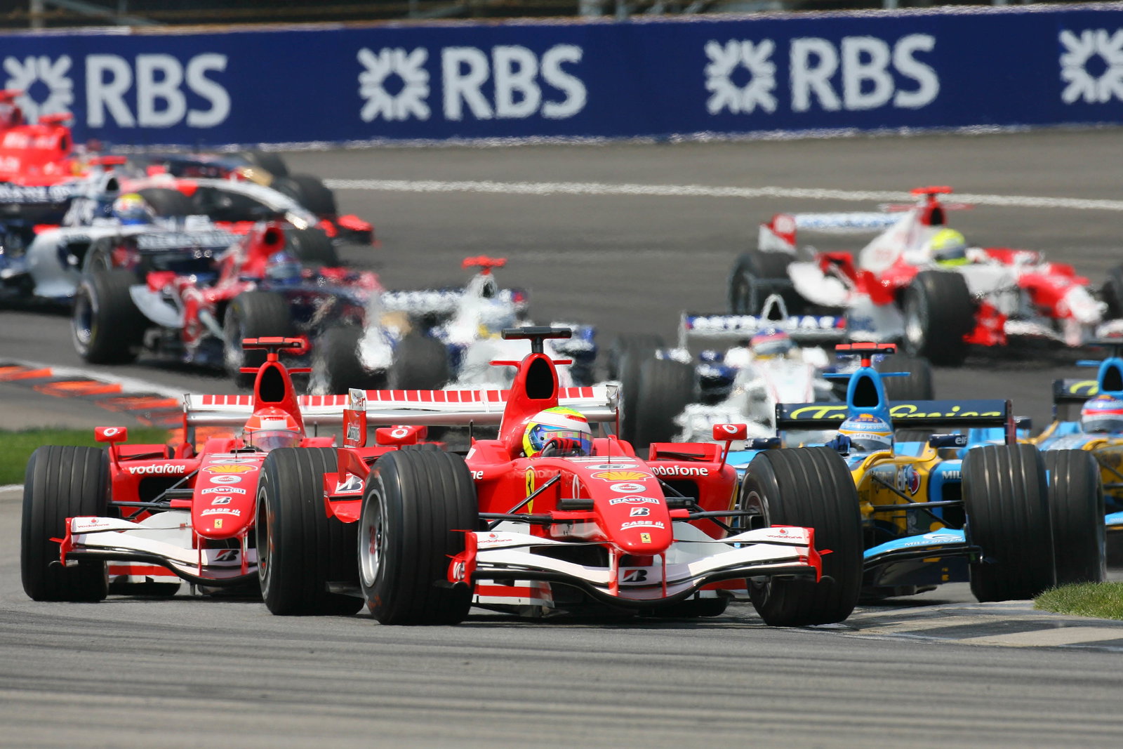 02.07.2006 Indianapolis, USA, Start, Felipe Massa (BRA), Scuderia Ferrari, 248 F1, leads Michael Sch