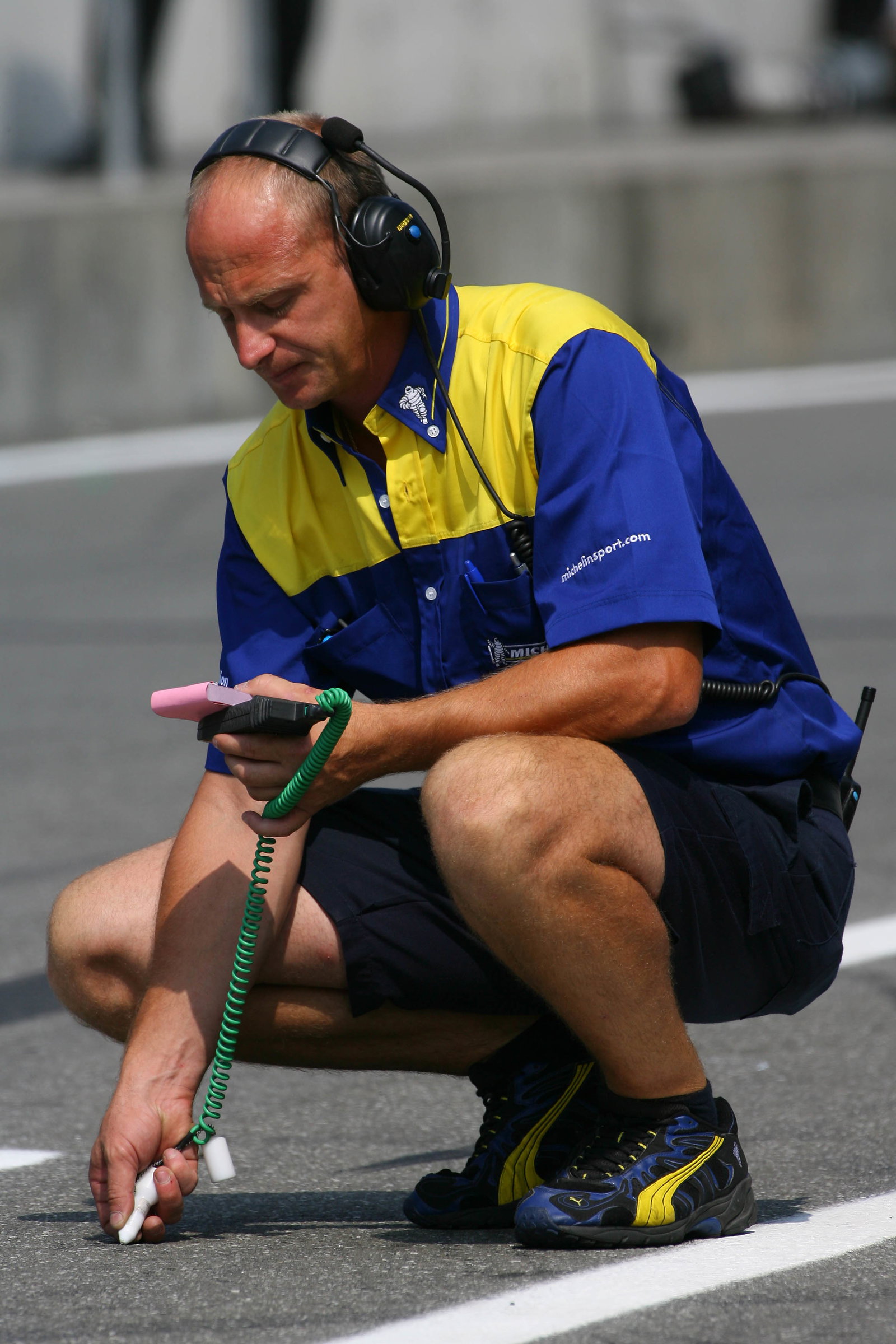 29.07.2006 Hockenheim, Germany, A Michelin Engineer checks the track temperature - Formula 1 World C