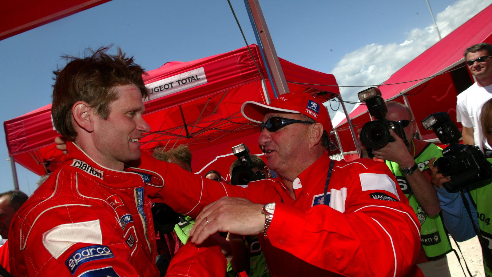 Jean-Pierre Nicolas, Peugeot Sport director, congratulates Marcus Gronholm after his win in Cyprus