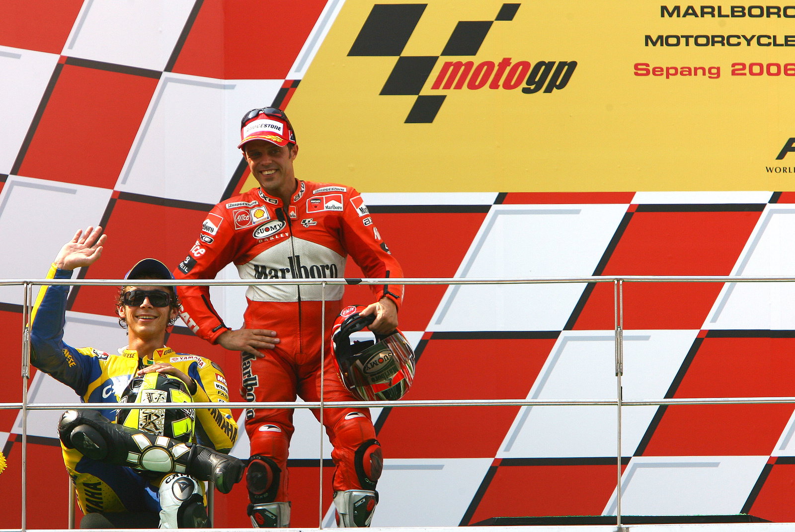 Rossi (1st) sits on chair on podium , Malaysian MotoGP 2006.
