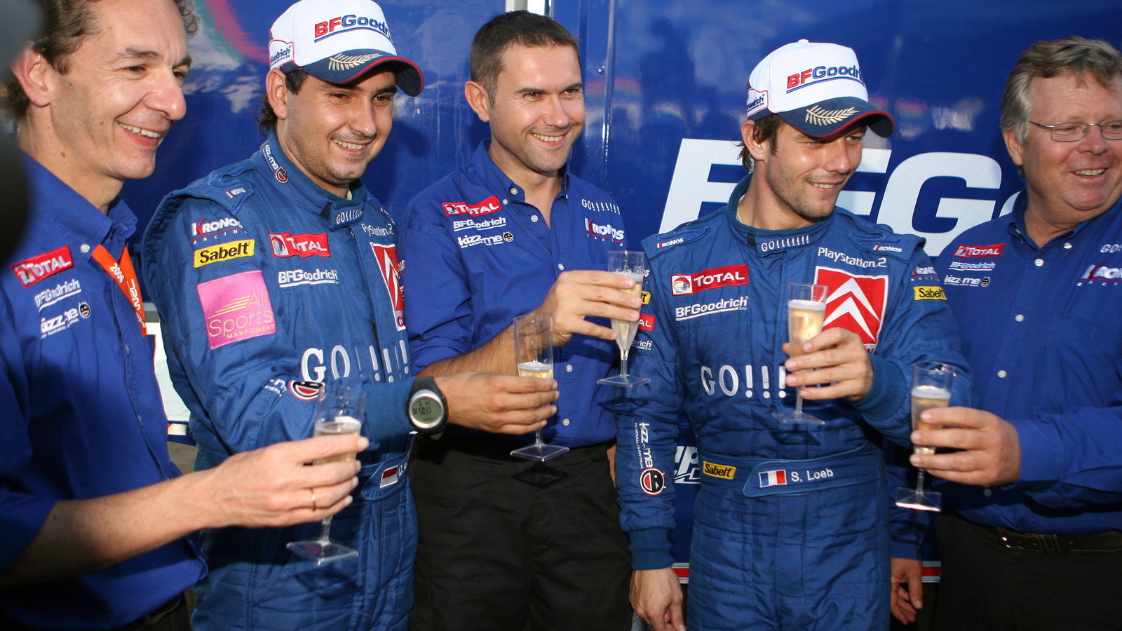Sebastien Loeb and Daniel Elena celebrate their Cyprus win with Kronos boss, Marc van Dalen and co W