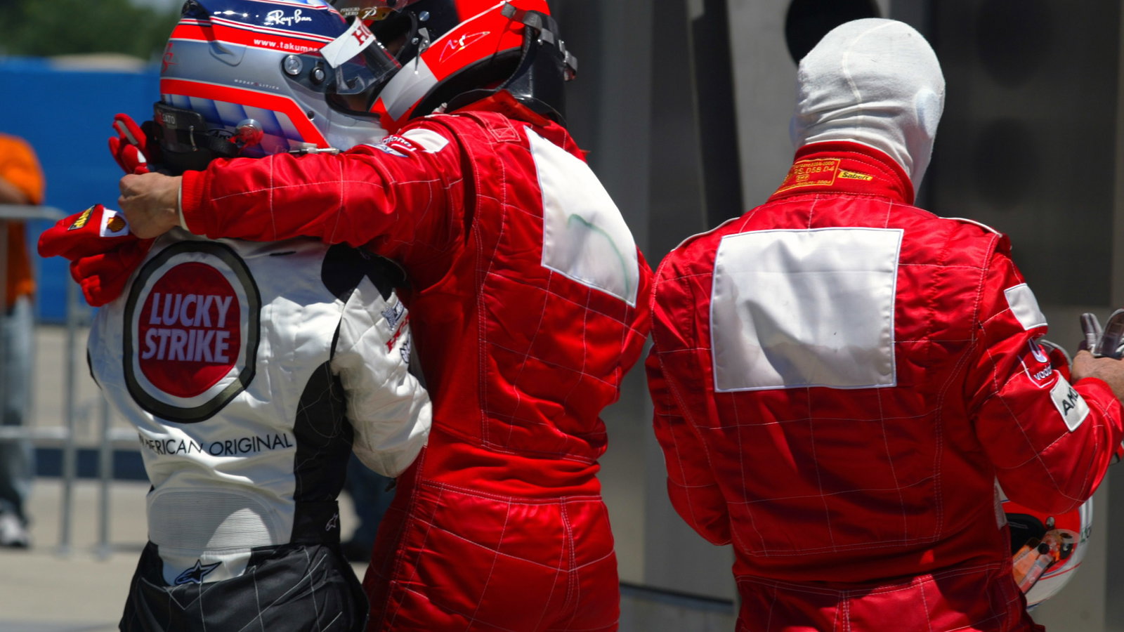 Michael Schumacher congratulates Takuma Sato