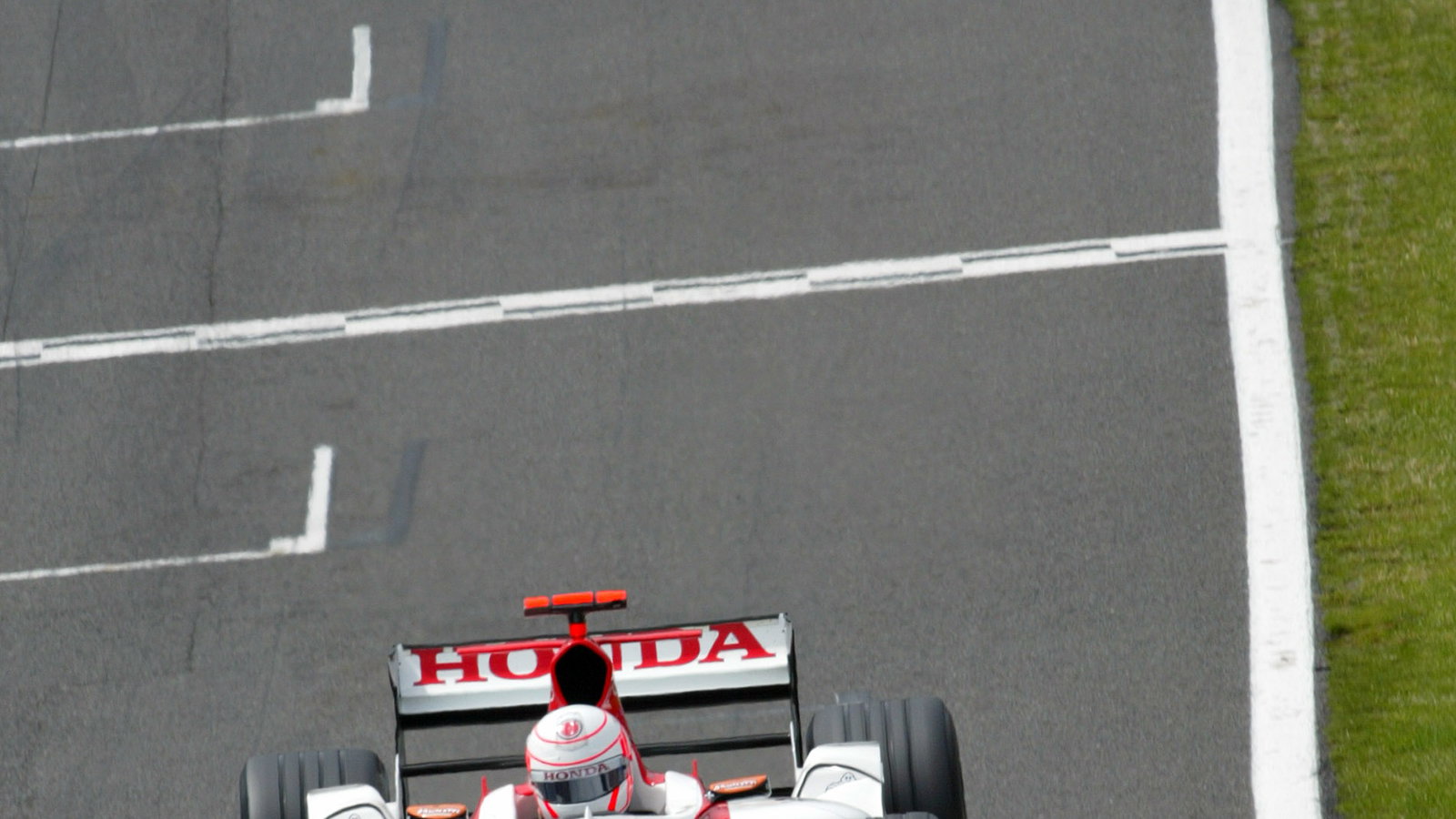 Jenson Button leads Ruibens Barrichello.