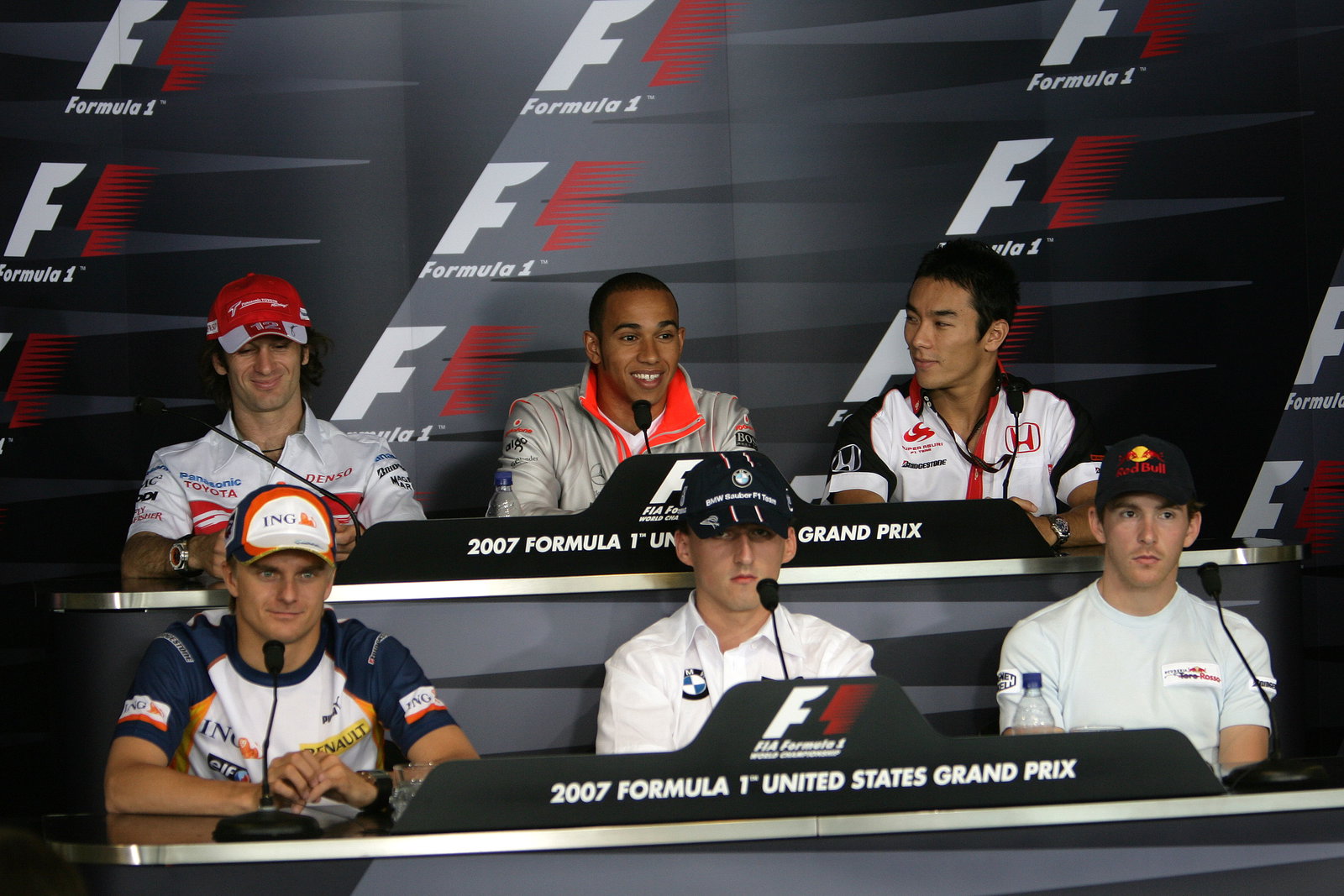 Jarno Trulli (ITA) Toyota TF107, Lewis Hamilton (GBR) McLaren MP4/22, Takuma Sato (JPN) Super Aguri 