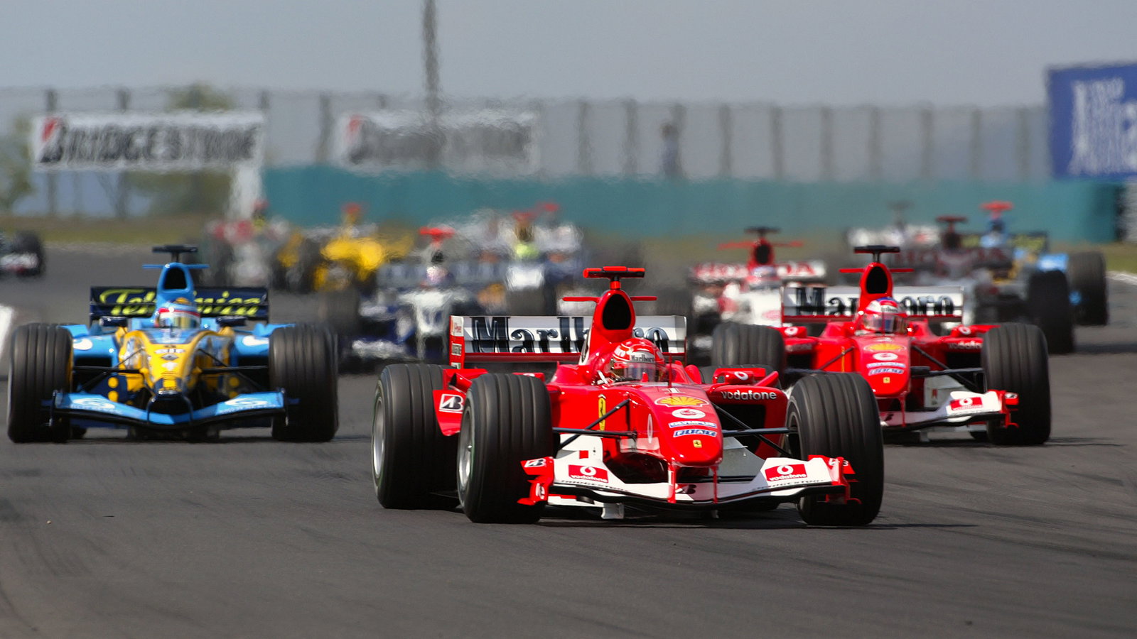 Michael Schumacher leads Ferrari team-mate Rubens Barrichello at the start of the Hungarian GP