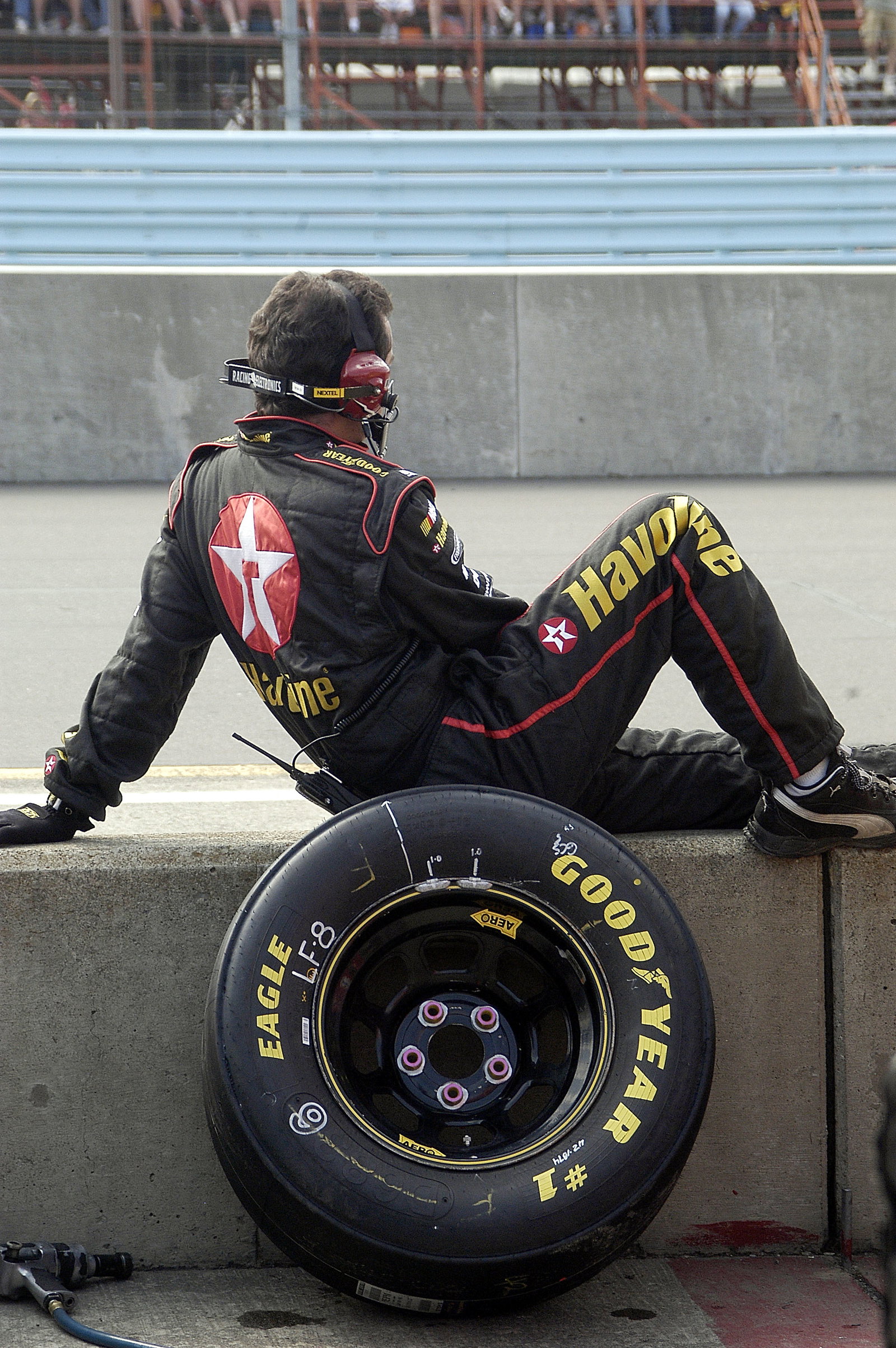 One of Jamie McMurray`s crew members waits on pit road at Watkins Glen.
