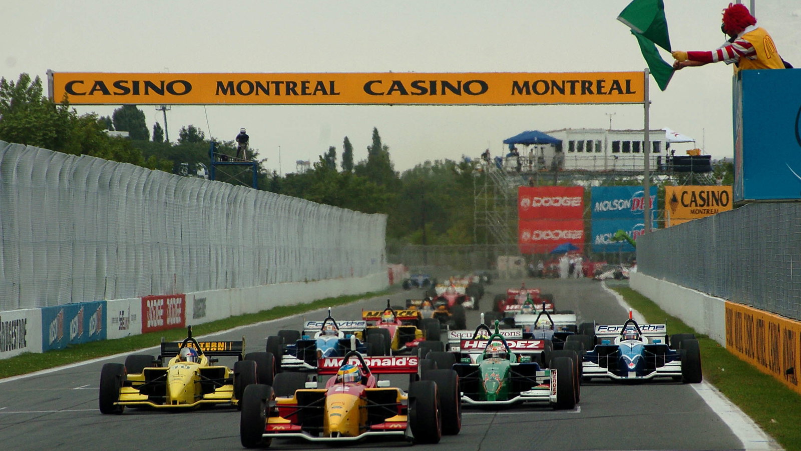 Ronald McDonald waves the green flag to get the Molson Indy Montreal underway