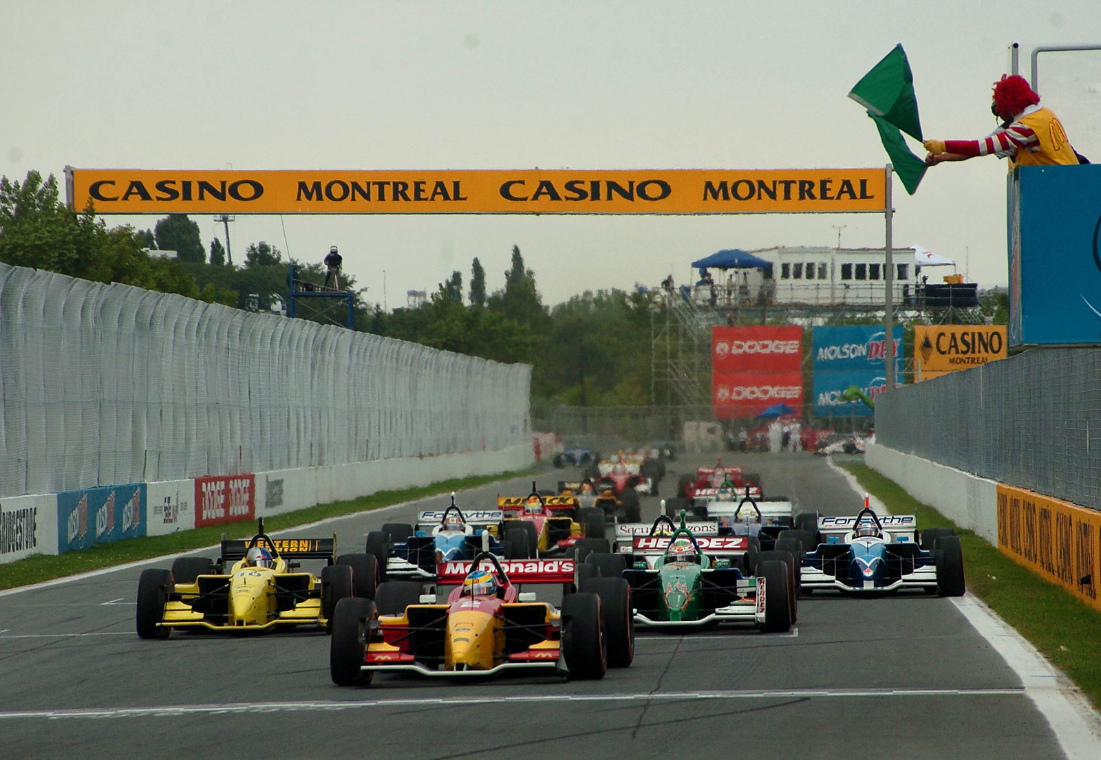 Ronald McDonald waves the green flag to get the Molson Indy Montreal underway
