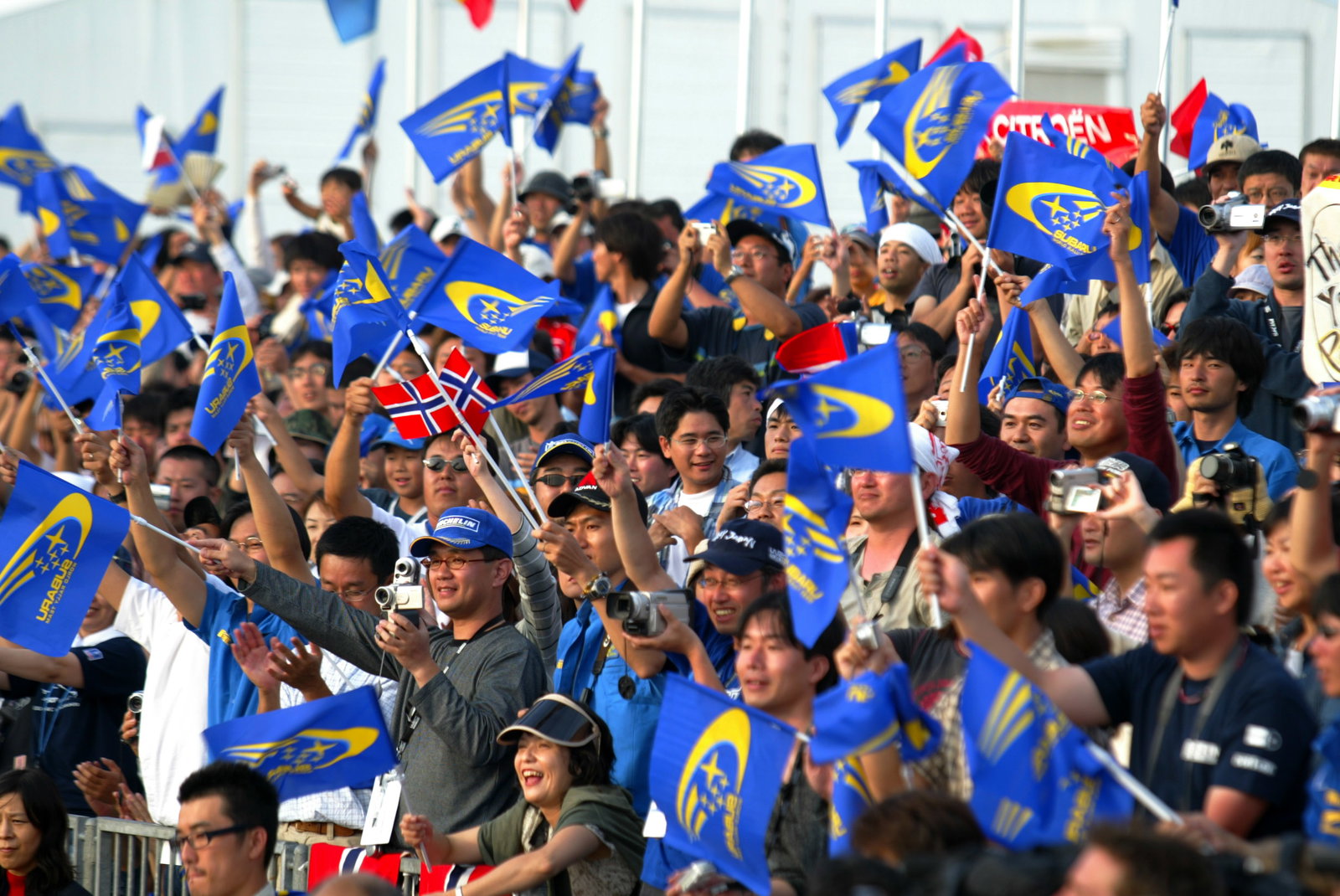 Subaru WRT fans celebrate at the finish area.
Rally Japan 2004, Leg 3, Sunday, 5 September 2004. Ph