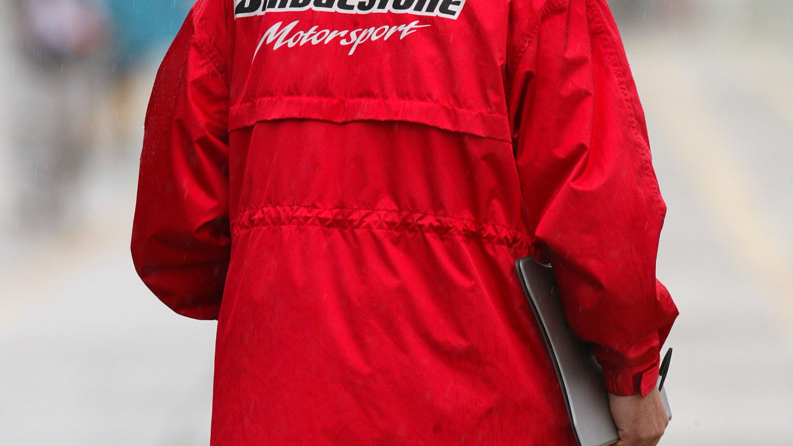 A Bridgesone tyre engineer studies the pit-lane conditions at the 2004 Japanese Grand Prix