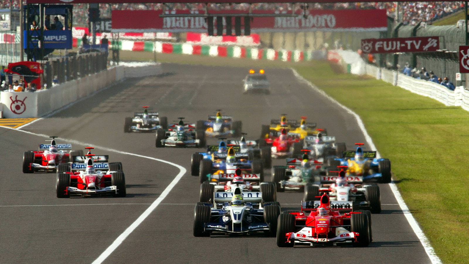 Michael Schumacher leads the field away at the start of the Japanese Grand Prix at Suzuka
