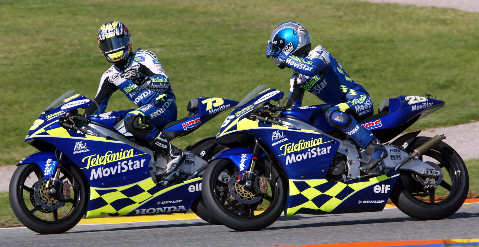 Telefonica Honda team-mates Aoyama and Pedrosa celebrate their 3-1 at Valencia, 250 GP 2004.