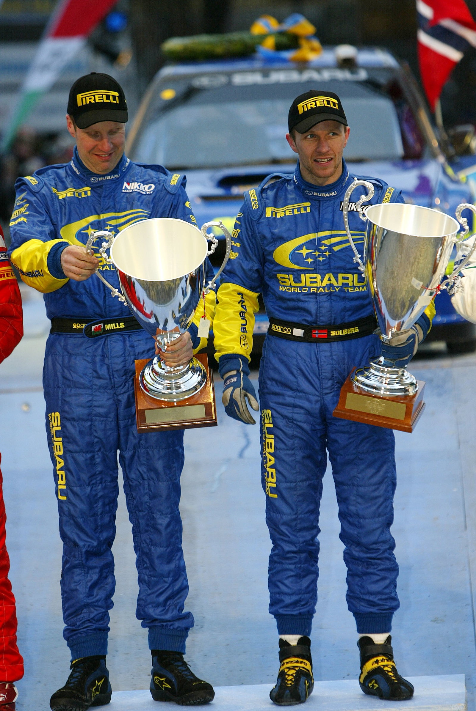 Subaru`s Petter Solberg and Phil Mills celebrate their victory on the Swedish Rally