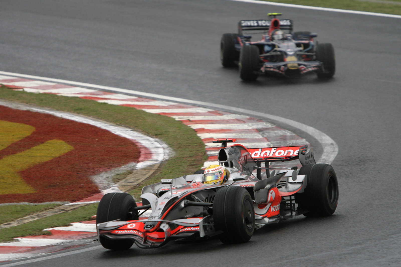 Lewis Hamilton (GBR) McLaren MP4-23, Sebastian Vettel (GER) Toro Rosso STR03, Brazilian F1 Grand Pri