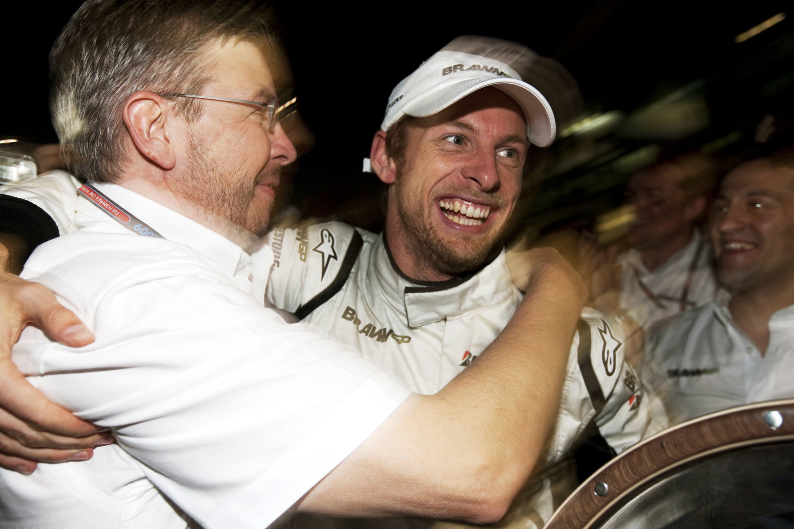 Ross Brawn (GBR) Team Principal, Brawn GP & Jenson Button (GBR) Brawn BGP001 Celebrate Maiden Win, A