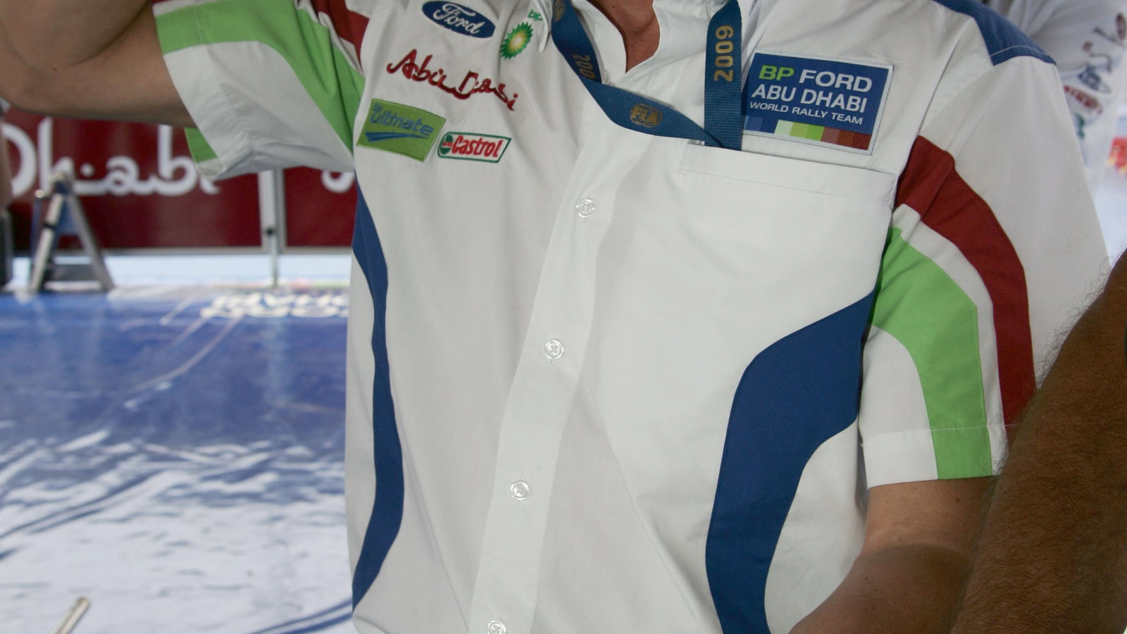 Malcolm Wilson (Gbr) CEO of Ford Focus Wrc Team wait Jari-Matti Latvala (fin) with a bottle of champ