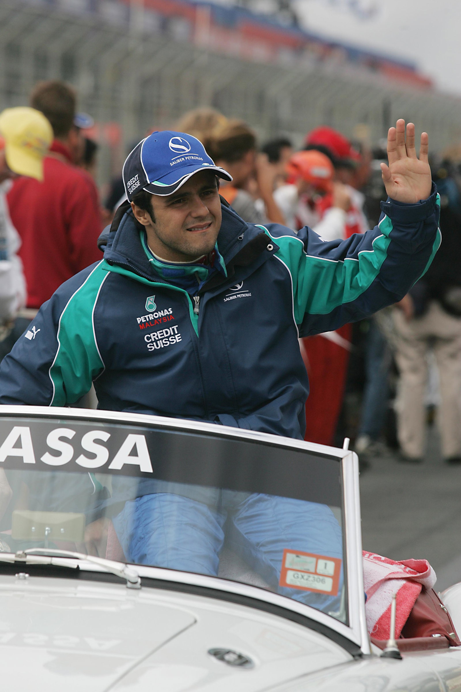 Felipe Massa waves to the Melbourne crowd during the drivers` parade