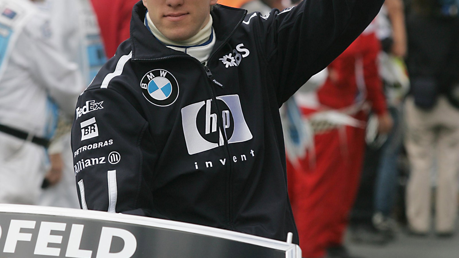 Nick Heidfeld waves to the Melbourne crowd during the drivers` parade