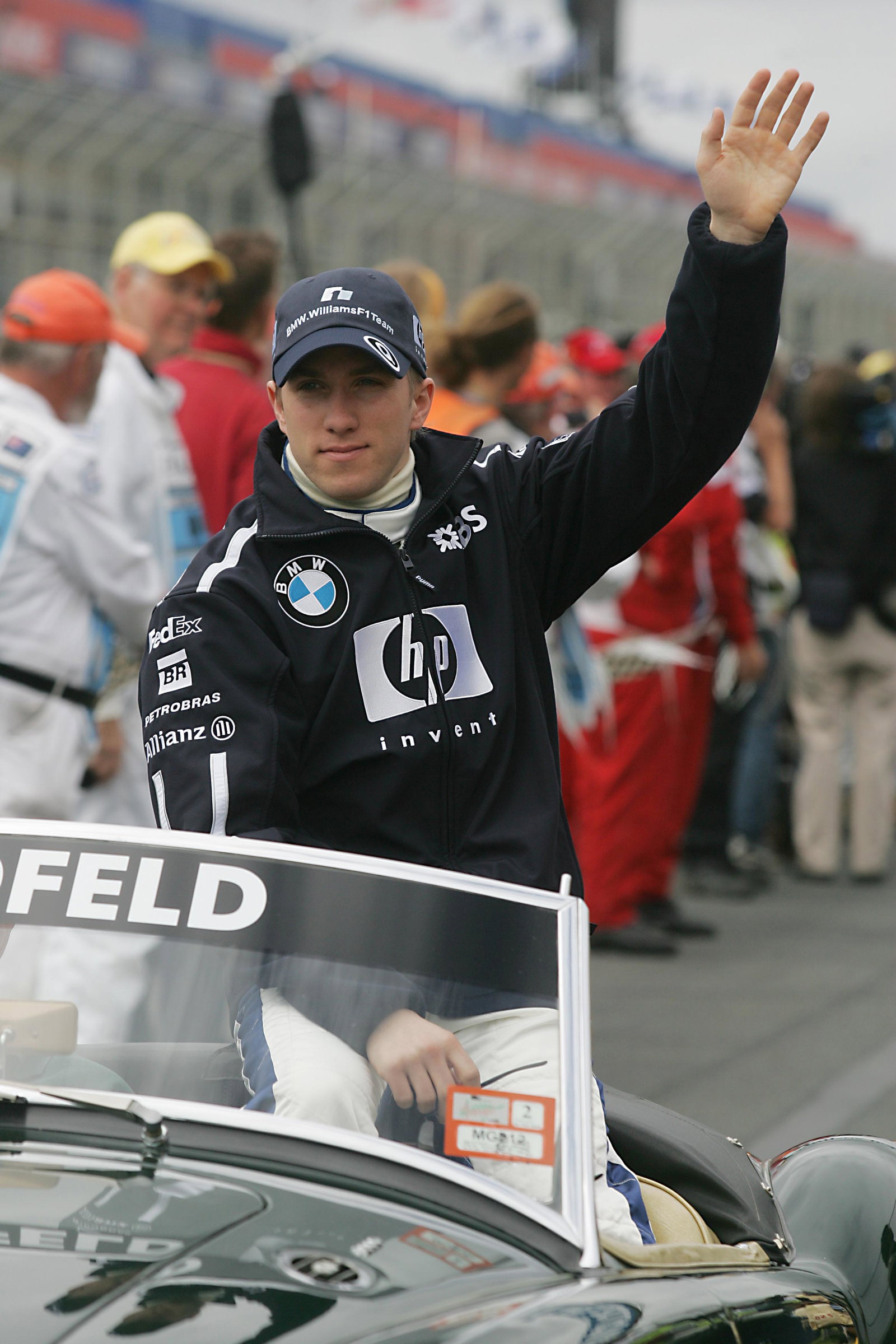 Nick Heidfeld waves to the Melbourne crowd during the drivers` parade