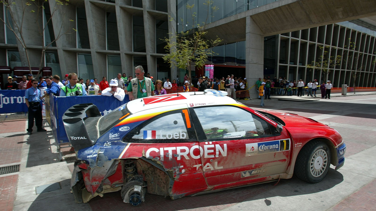Citroen`s Sebastien Loeb limped his Xsara WRC back to service on three wheels after problems in the 