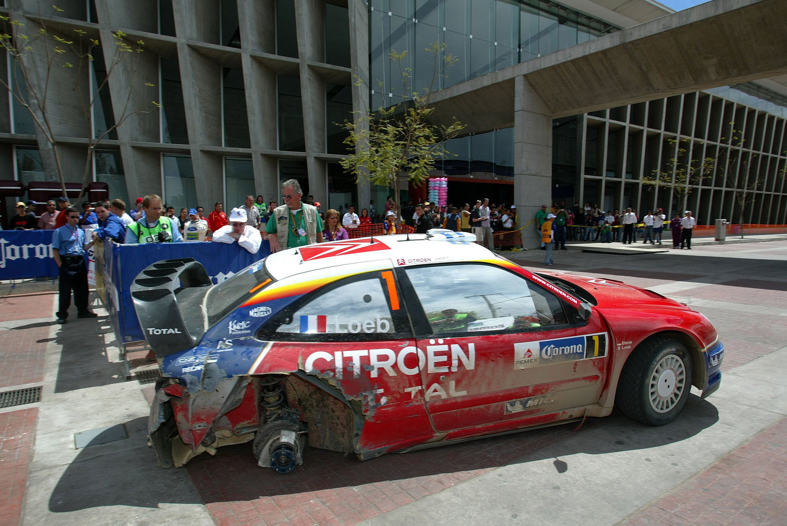 Citroen`s Sebastien Loeb limped his Xsara WRC back to service on three wheels after problems in the 