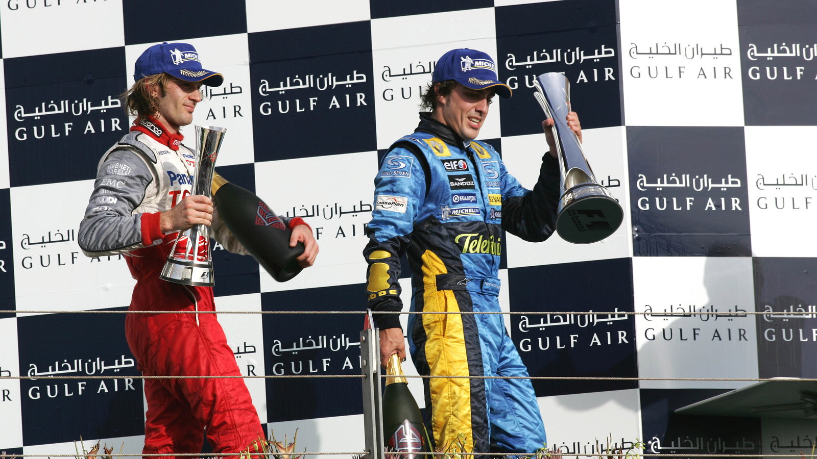 Bahrain GP winner, Fernando Alonso with Jarno Trulli [2nd]