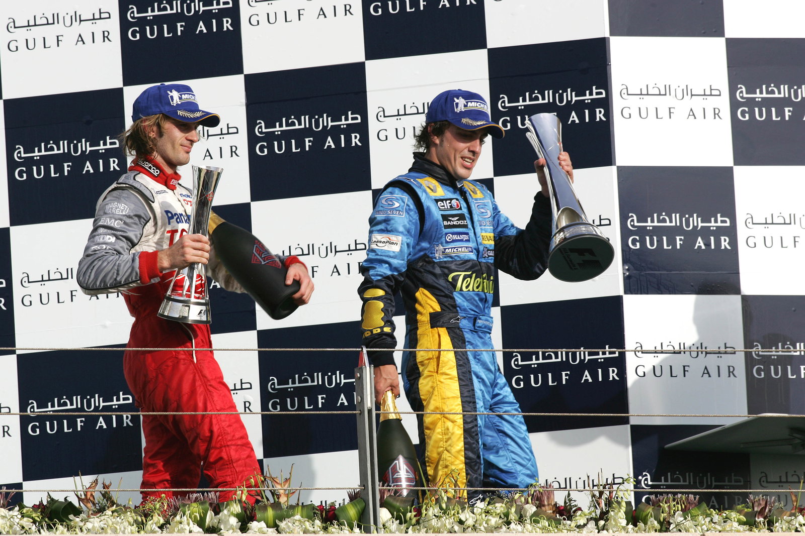 Bahrain GP winner, Fernando Alonso with Jarno Trulli [2nd]