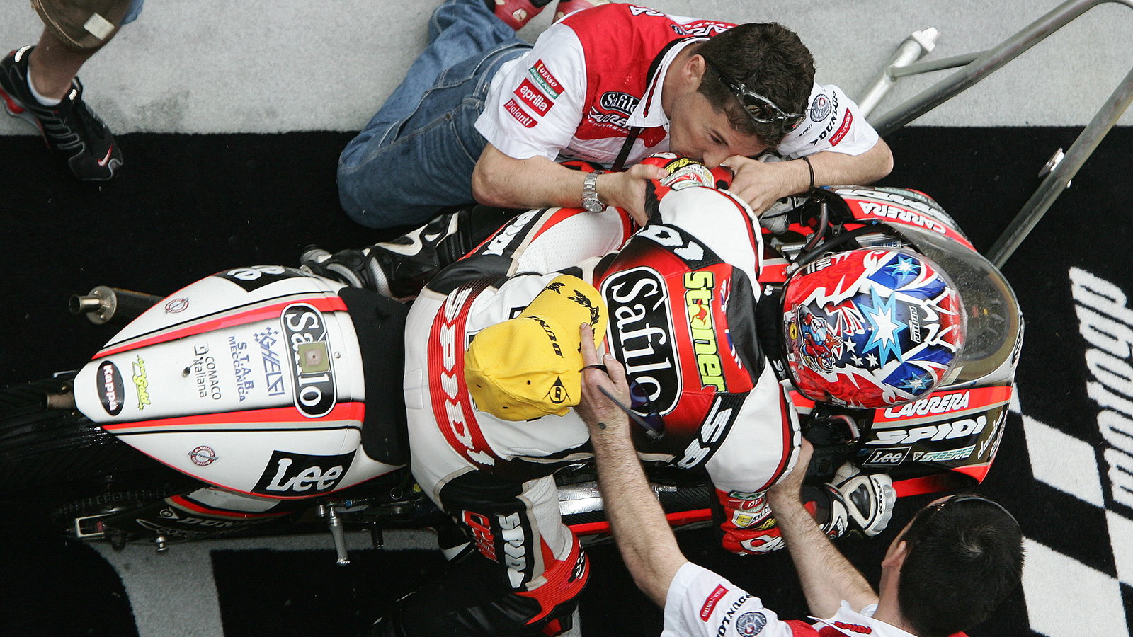Cecchinello kisses Stoner in celebration, Chinese 250GP Race 2005